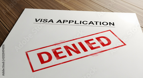 Denied visa application form with rejection stamp