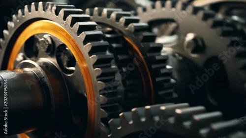 Close-up View of Interlocking Metal Gears in a Machine.
