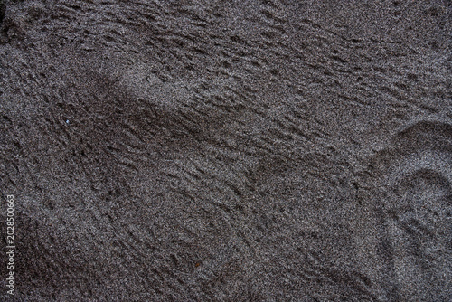 Obraz na plátně High-resolution texture of dark volcanic beach sand