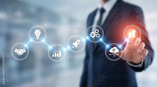 Businessman Touching Digital Interface With Icons For Business Growth Innovation Strategy And Success In Office