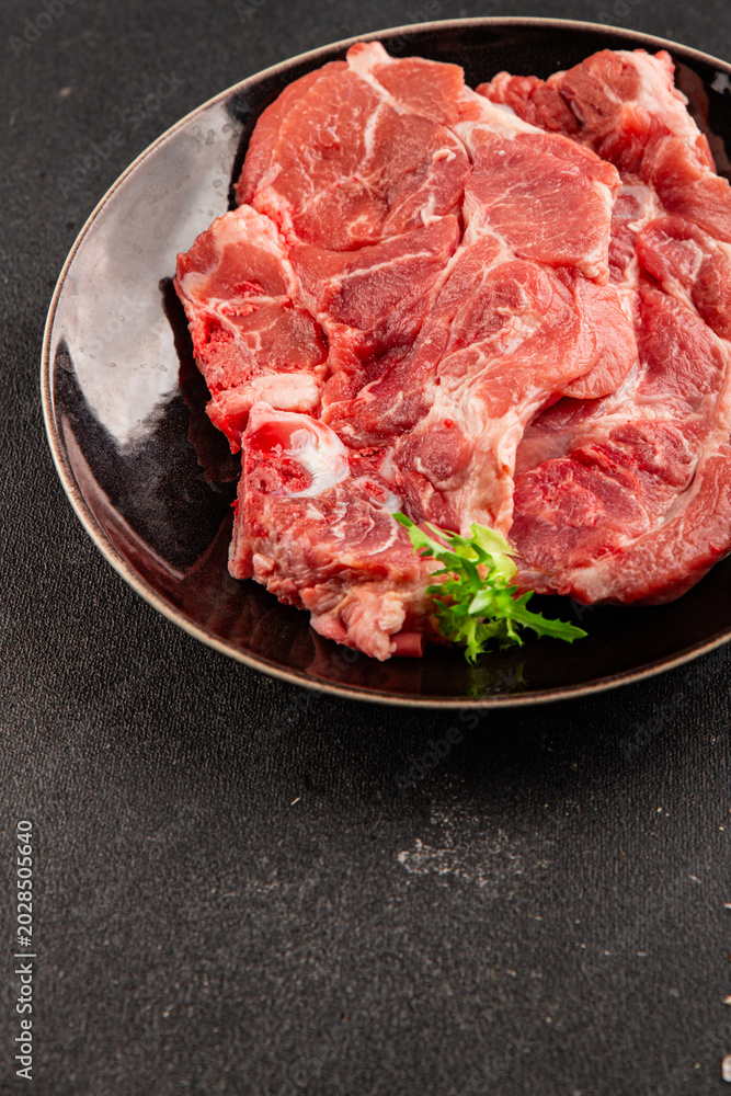 Fototapeta premium Raw pork steak pork tenderloin, food preparation lunch or dinner tasty organic snack fresh farm product delicious gourmet food background on the table rustic food, top view copy space