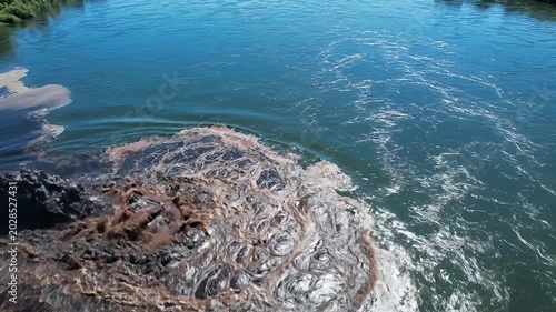 Polluted Water Swirling and Flowing Into Blue River from Industrial Drainage Point
