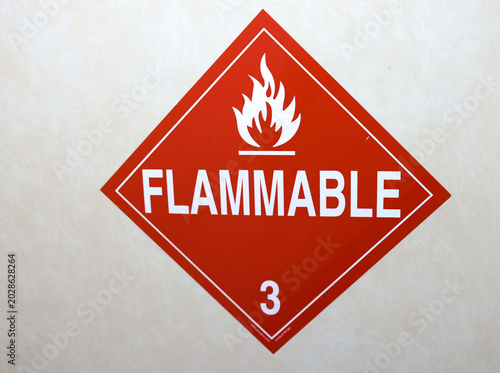 Flammable Hazard Warning Sign on Industrial Container – Red Safety Label for Dangerous Materials