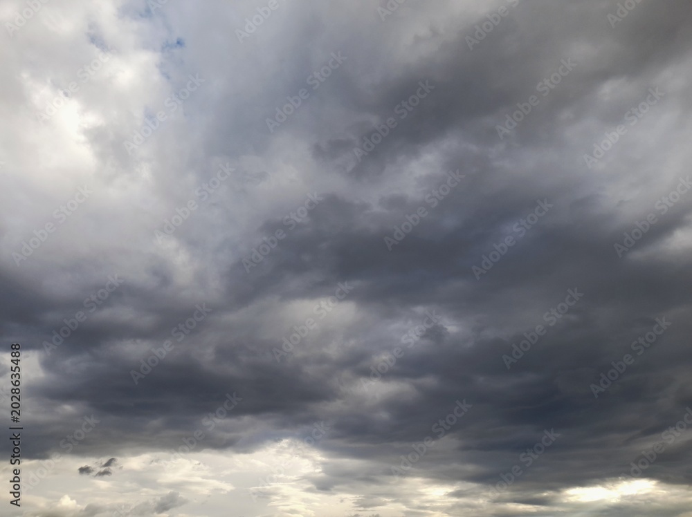 Fototapeta premium Dramatic dark storm clouds in the sky before rain background