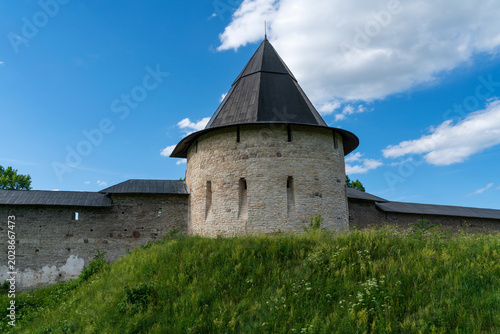 Photos Izborsk Tower of the Holy Dormition Pskov-Pechersk Monastery on a sunny summer d
