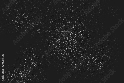 Foto Dense white speckles scattered over a dark black background, creating a grunge t
