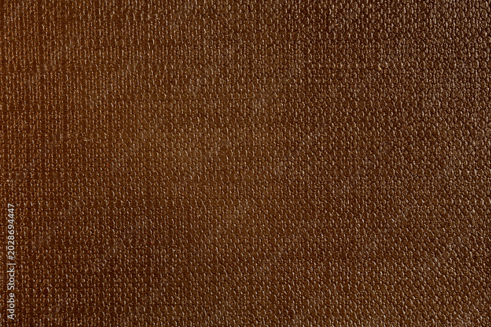 Fototapeta premium Brown synthetic leather texture surface with uniform pebbled grain pattern