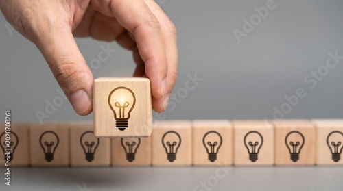 Holding a glowing bulb icon block next to a row of off lamps
