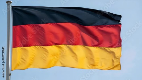 German flag waving against clear blue sky  