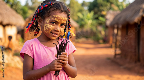 Malagasy girl child Madagascar traditional portrait Africa island indigenous cultural heritage authentic ancestral identity childhood cute warm smile bright eyes ethnic rural community young female