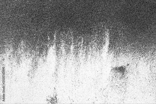 Vászonkép Monochromatic abstract image displays a granular texture with a gradient effect transitioning from dense dark speckles at the top to sparse lighter speckles at the bottom