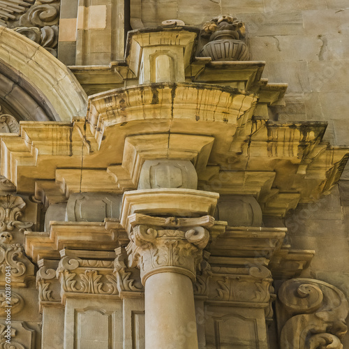 Manresa, Spain - October 1, 2025: Architectural stone detail at the Sanctuary of the Cave of Saint Ignatius in Manresa, Catalonia, Spain. Ornamental historic facade with carved column