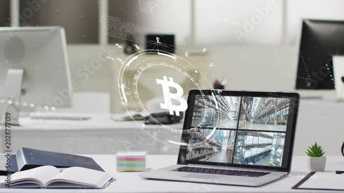 System activating, Bitcoin HUD emerging by laptop, rotating and pulsing showing 4-up warehouse cams