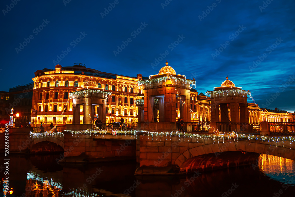 Fototapeta premium View of the Lomonosov Bridge at night. Festive illuminations.