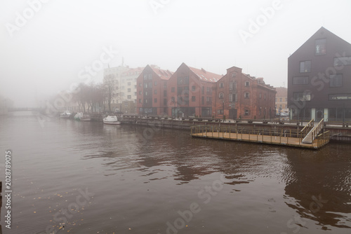 Foggy canal promenade