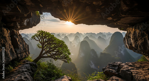 Sunrise over Mountain Range through Cave Entrance