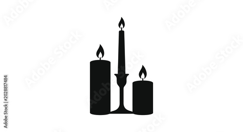 Photos Three burning candles in black silhouette