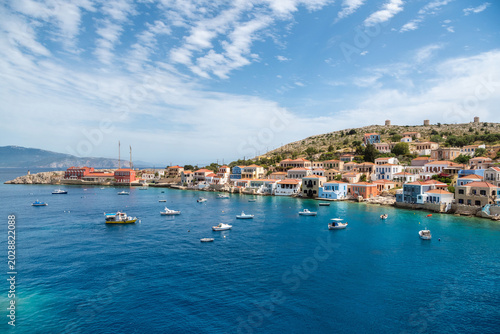 Emborios harbor and turquoise bay on Halki Island, Greece.