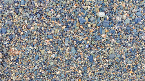 Bild auf Leinwand Close up of small beach pebbles texture