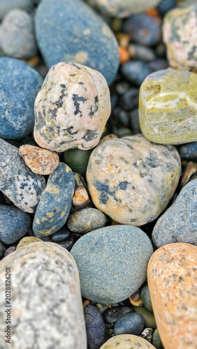 Schilderij op canvas Close up of smooth colorful pebble stones