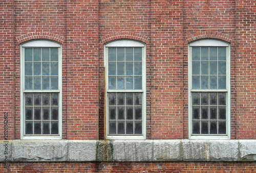 facade view of brick wall and window of old factory building