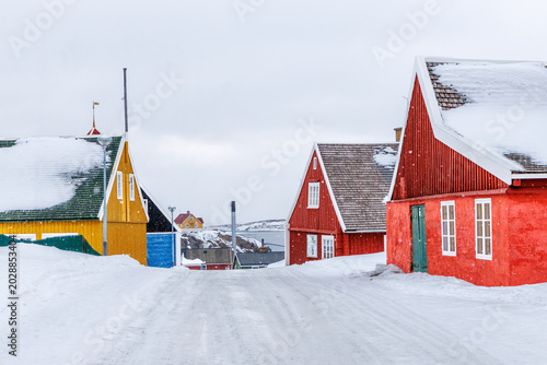 Εκτύπωση καμβά Colorful houses in the historic center of Sisimiut during snowfall with traditio
