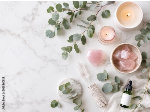 Minimal Wellness Flat Lay with Eucalyptus, Candles and Rose Quartz