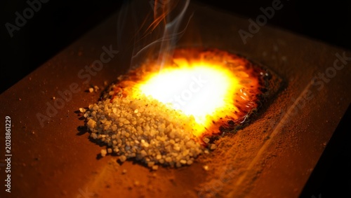 Konstfotografi Extreme macro of welding flux granules surrounding a white-hot submerged arc weld point