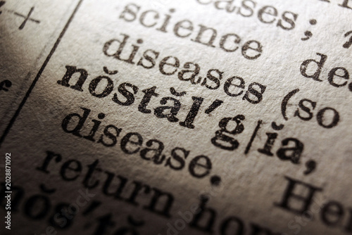 Foto Word nostalgia on dictionary page, macro close up