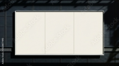 Quadro su tela A blank horizontal three-panel billboard mockup mounted on a modern dark ribbed wall with soft daylight shadows