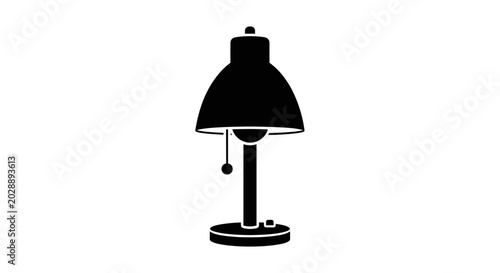 Black desk lamp on table indoors.