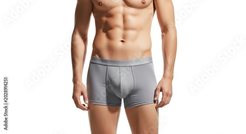 Man wearing gray athletic underwear standing.