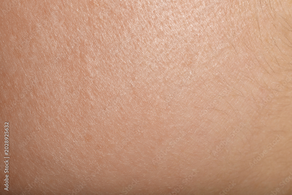Fototapeta premium Texture of normal skin as background, closeup