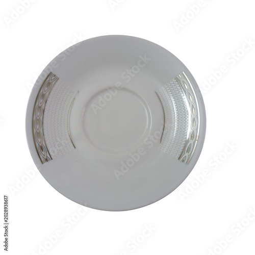 White ceramic plate on a saucer
