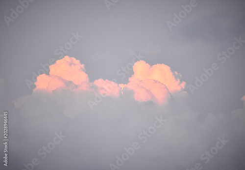Blue sky with clouds and sunset light