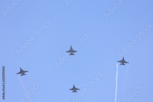 Schilderij op canvas Indonesian Air Force F-16 Fighting Falcon jet fighters flying in formation