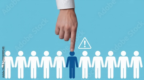 Hand choosing person from line with warning sign on blue background