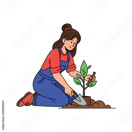 Young gardener planting a seedling outdoors.