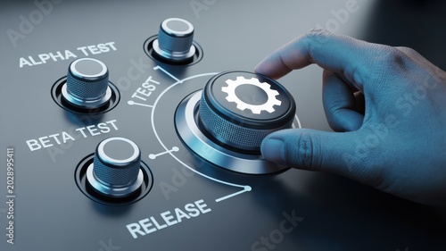 Hand turns dial to release software from beta test to release stage