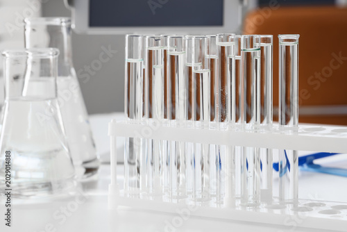 Test tubes and glassware of water samples on table in research laboratory