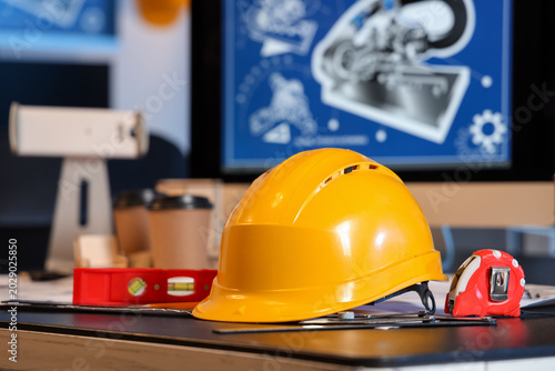 Hardhat with tools on engin...