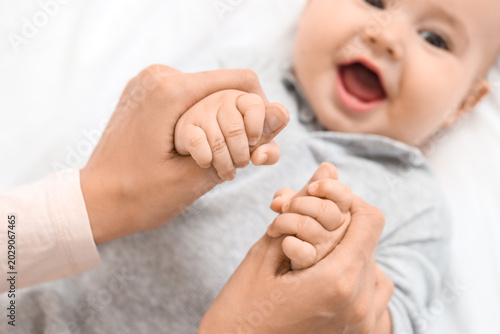 Mother holding her happy li...