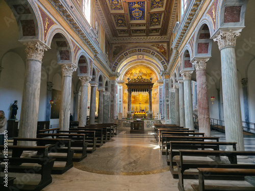 Interior view of Basilica of San Nicola in Carcere with ancient columns and wooden ceiling in Rome, Italy