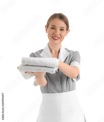 Pretty chambermaid holding ...