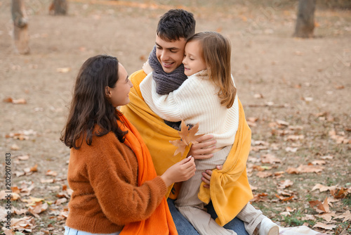 Happy family with warm blan...
