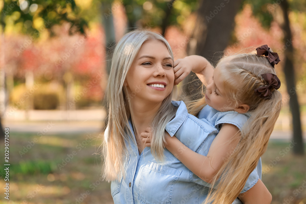 Fototapeta premium Happy mother with her little daughter in park