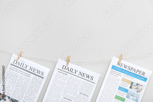 Newspapers hanging on rope ...