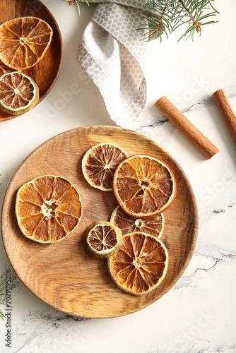 Wooden plate with dried ora...