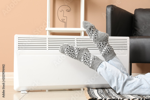 Young woman in warm socks n...