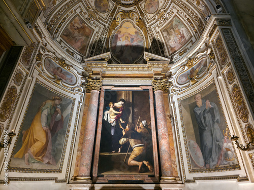 Madonna of Loreto masterpiece painting by Caravaggio in Cavalletti chapel inside Sant Agostino church, Rome